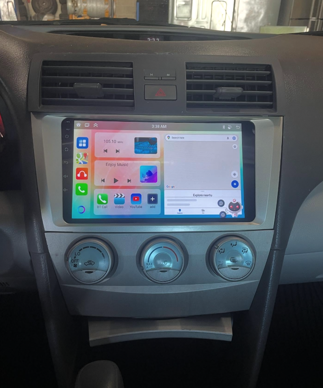 Aftermarket touchscreen head unit installed in a dashboard