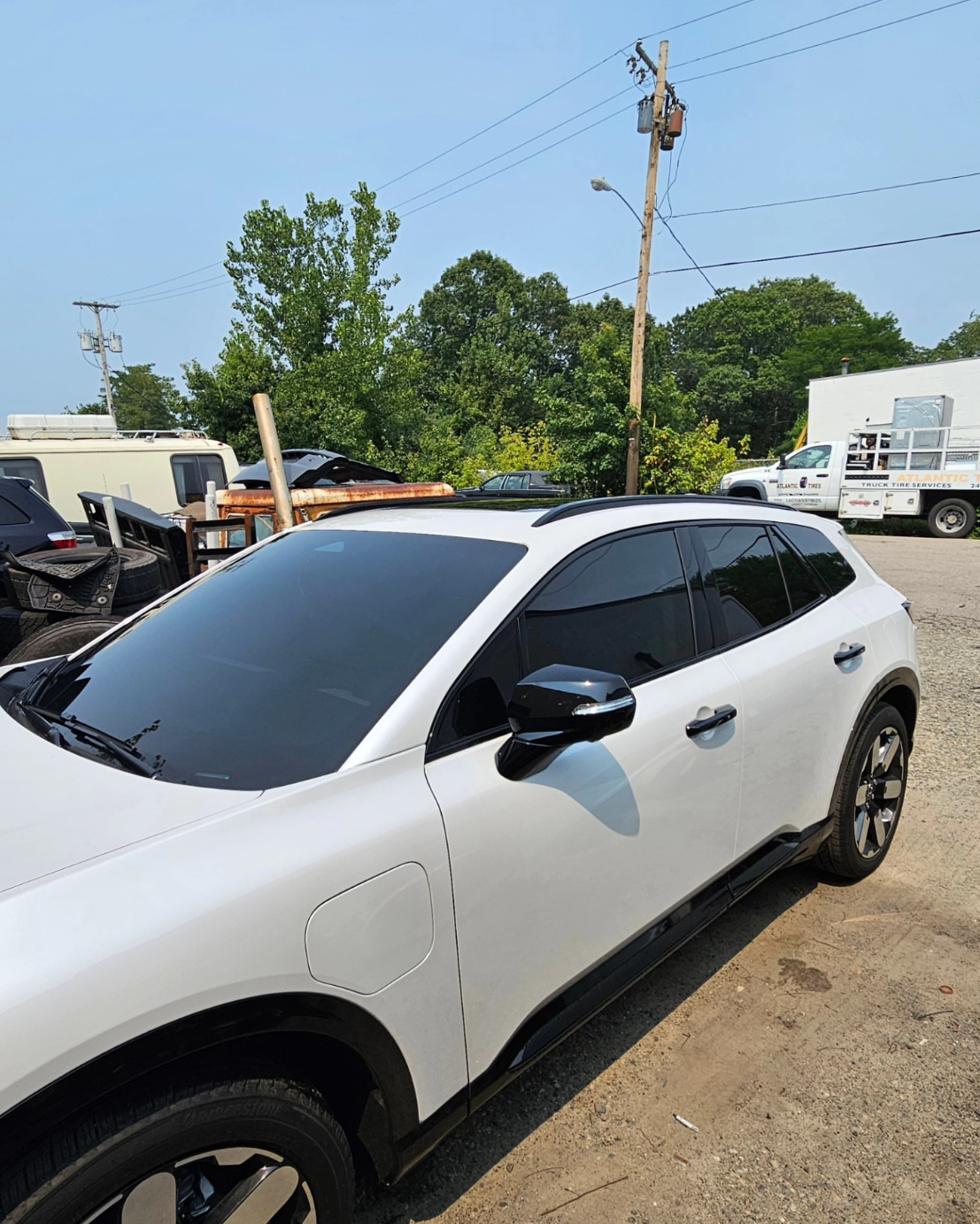 White SUV with freshly tinted windows